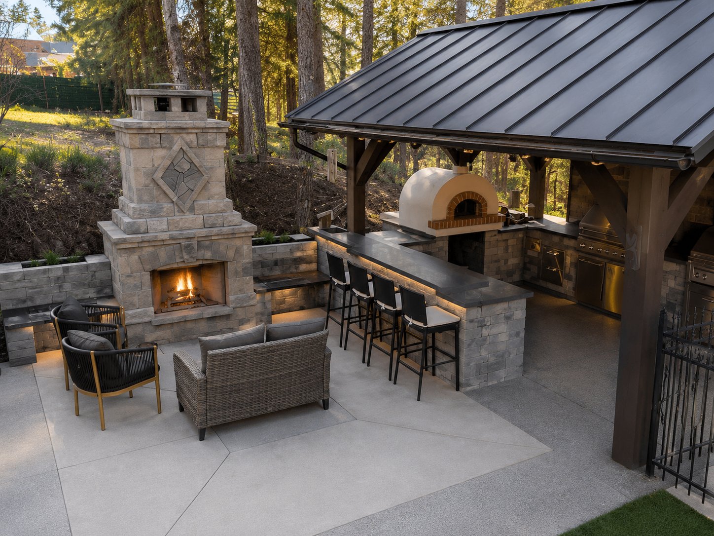 Outdoor kitchen and fire feature at the Outdoor Kitchen & Fire Feature Combo | Predator Ridge project by Kalagan Outdoor Design