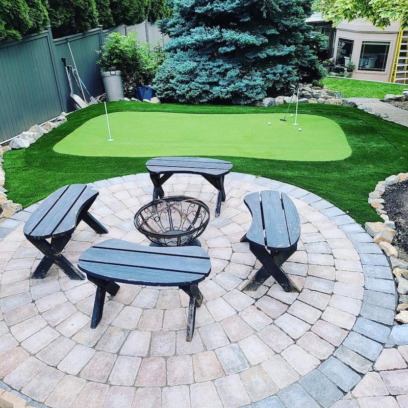 Kalagan Outdoor Design putting green near patio chairs