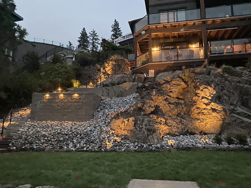 Kalagan Outdoor Design steps up retaining wall front view with lighting