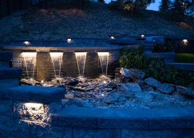 Kalagan Outdoor Design waterfall with custom iron grills