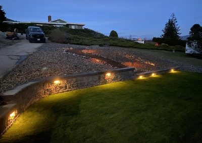 Kalagan Outdoor Design xerisc and retaining wall dusk